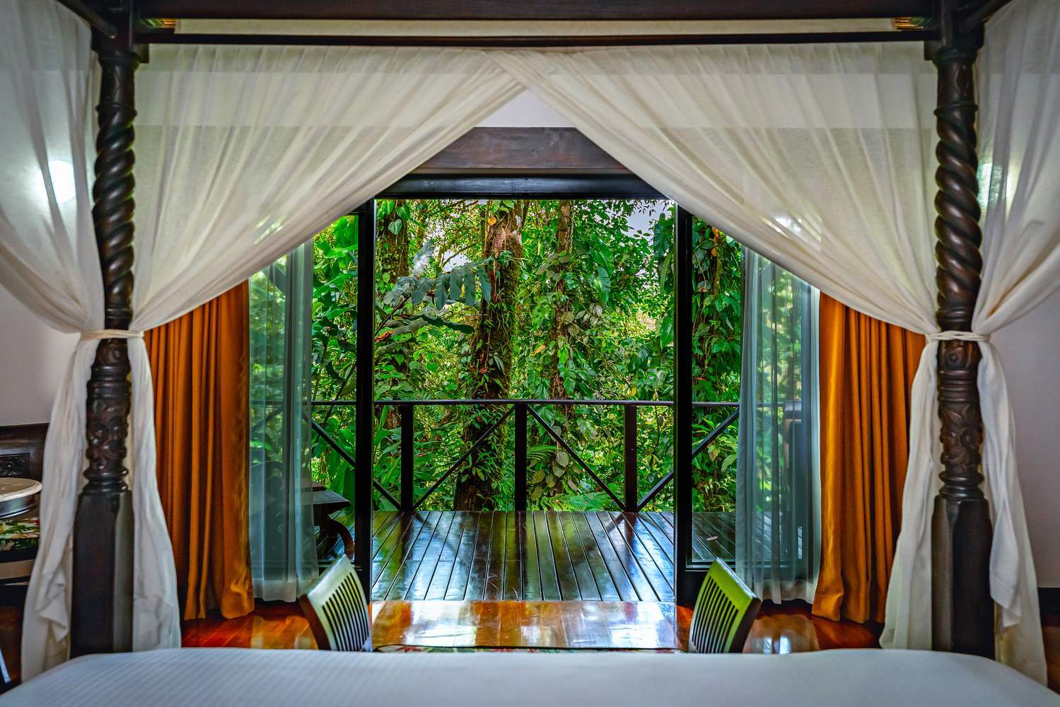 View onto a terrace with greenery from the bedroom at Hotel Rio Celeste, Costa Rica