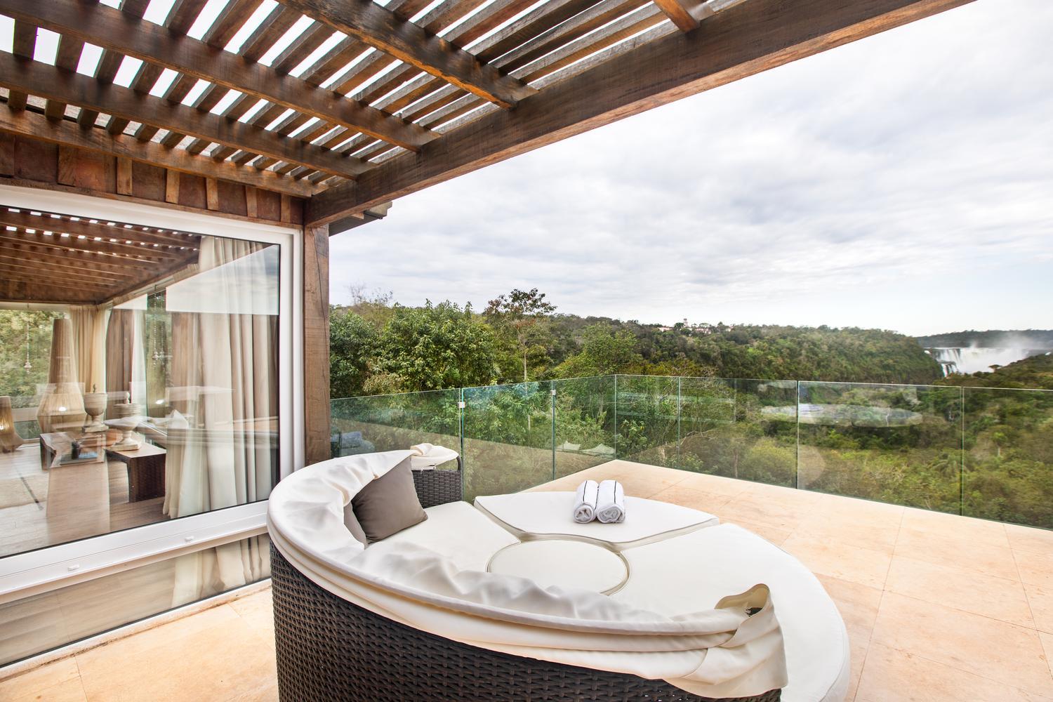 Balcony with comfortable seating at Gran Melia Iguazu