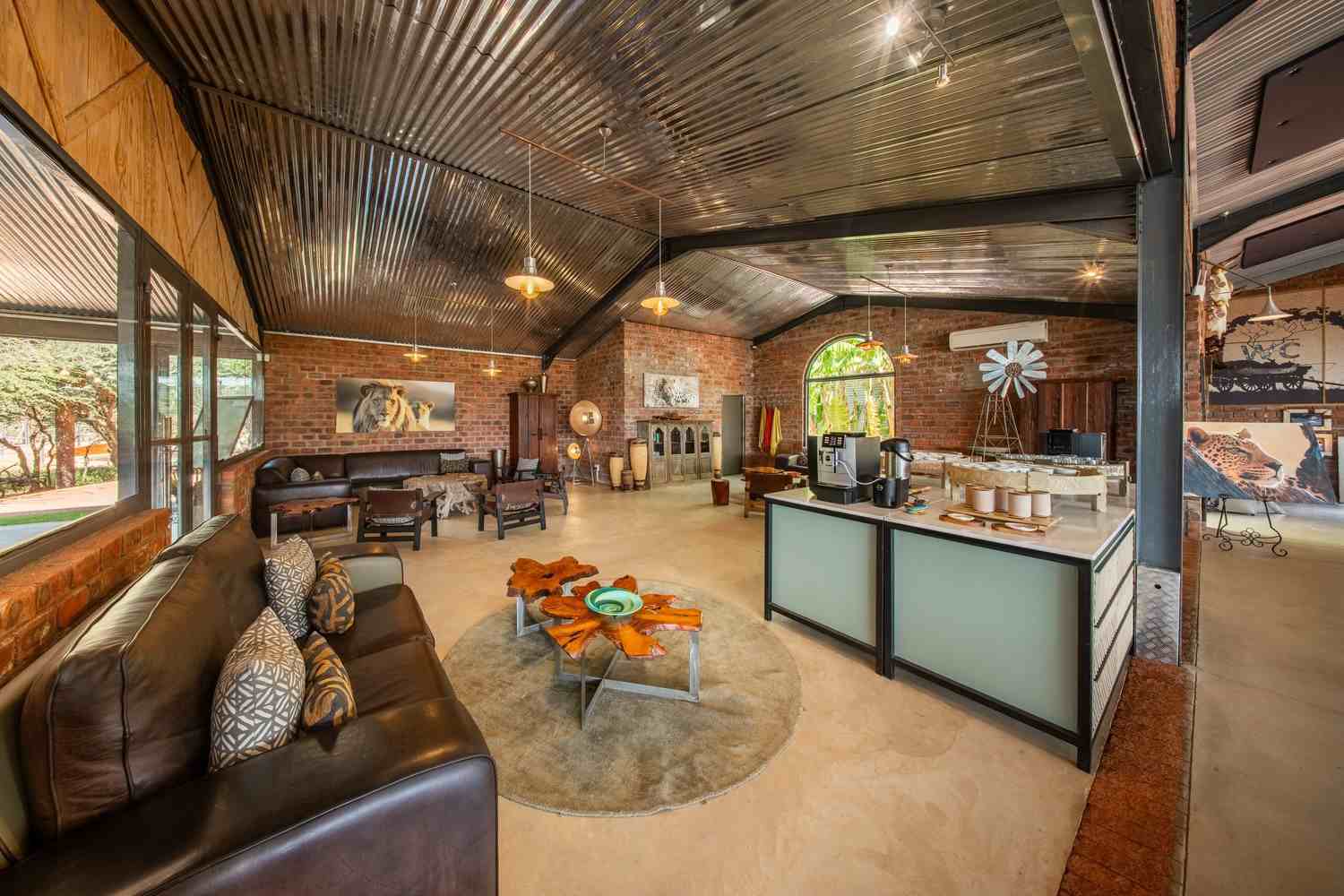 Social seating areas inside The Barn at Okonjima Plains Camp