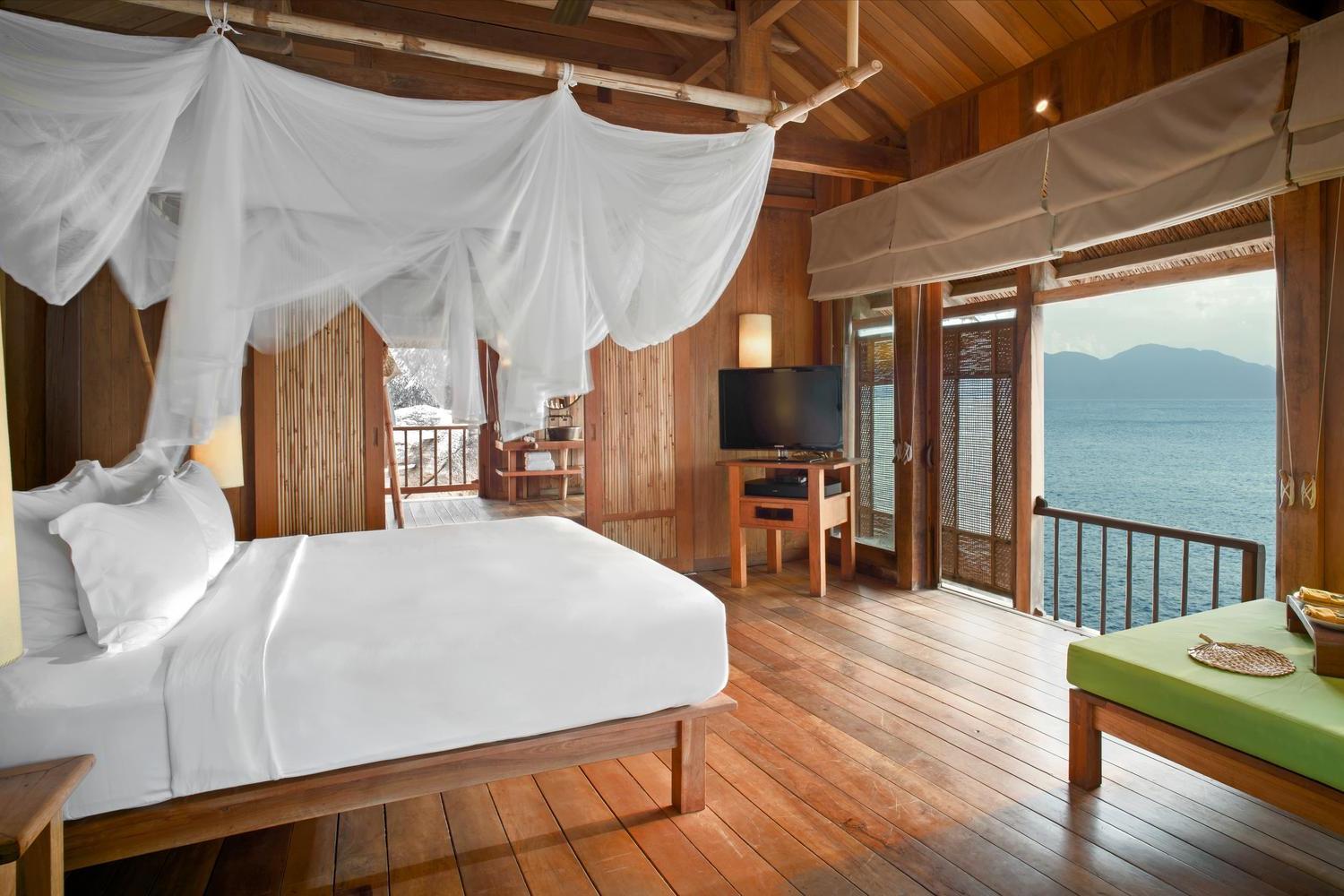 Bedroom in a water pool villa at Six Senses Ninh Van Bay