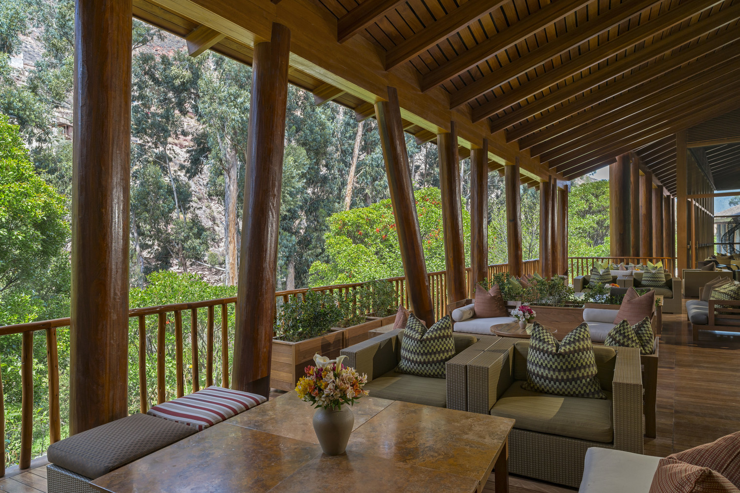 Covered outdoor terrace looking out onto the trees at Tambo del Inka, Peru