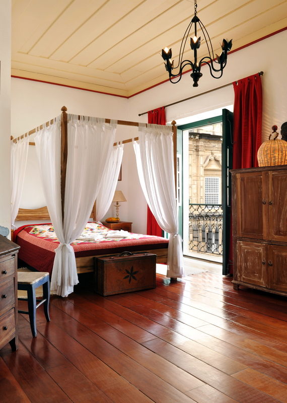 A guest room with four poster bed at Villa Bahia, Salvador