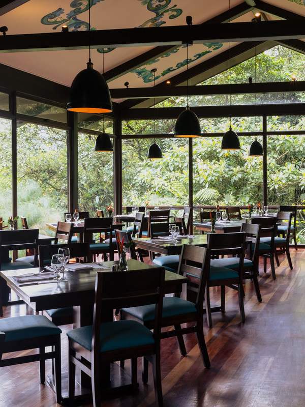 The main dining area at El Silencio in Costa Rica overlooking dense forest.