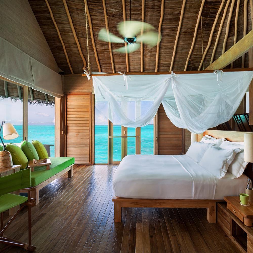 A bedroom at Six Senses Laamu