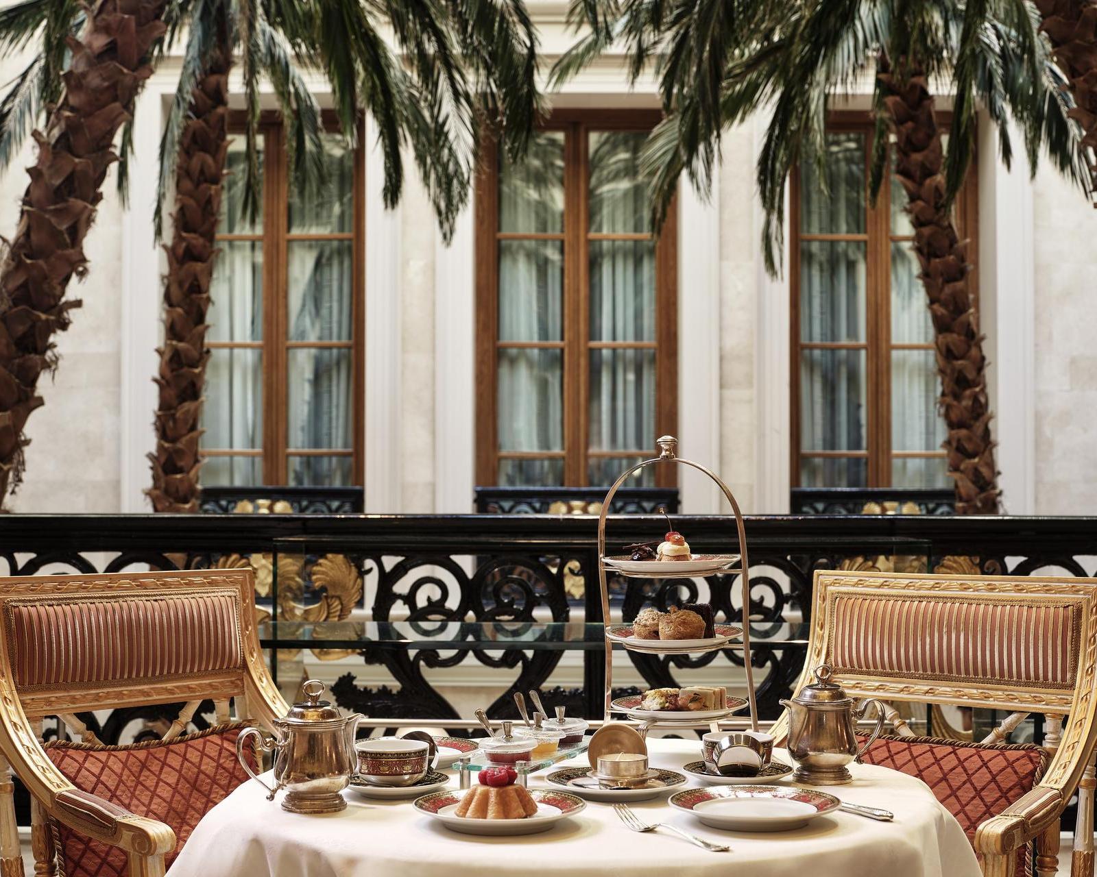 Outdoor seating with afternoon tea set up at Hotel Grande Bretagne