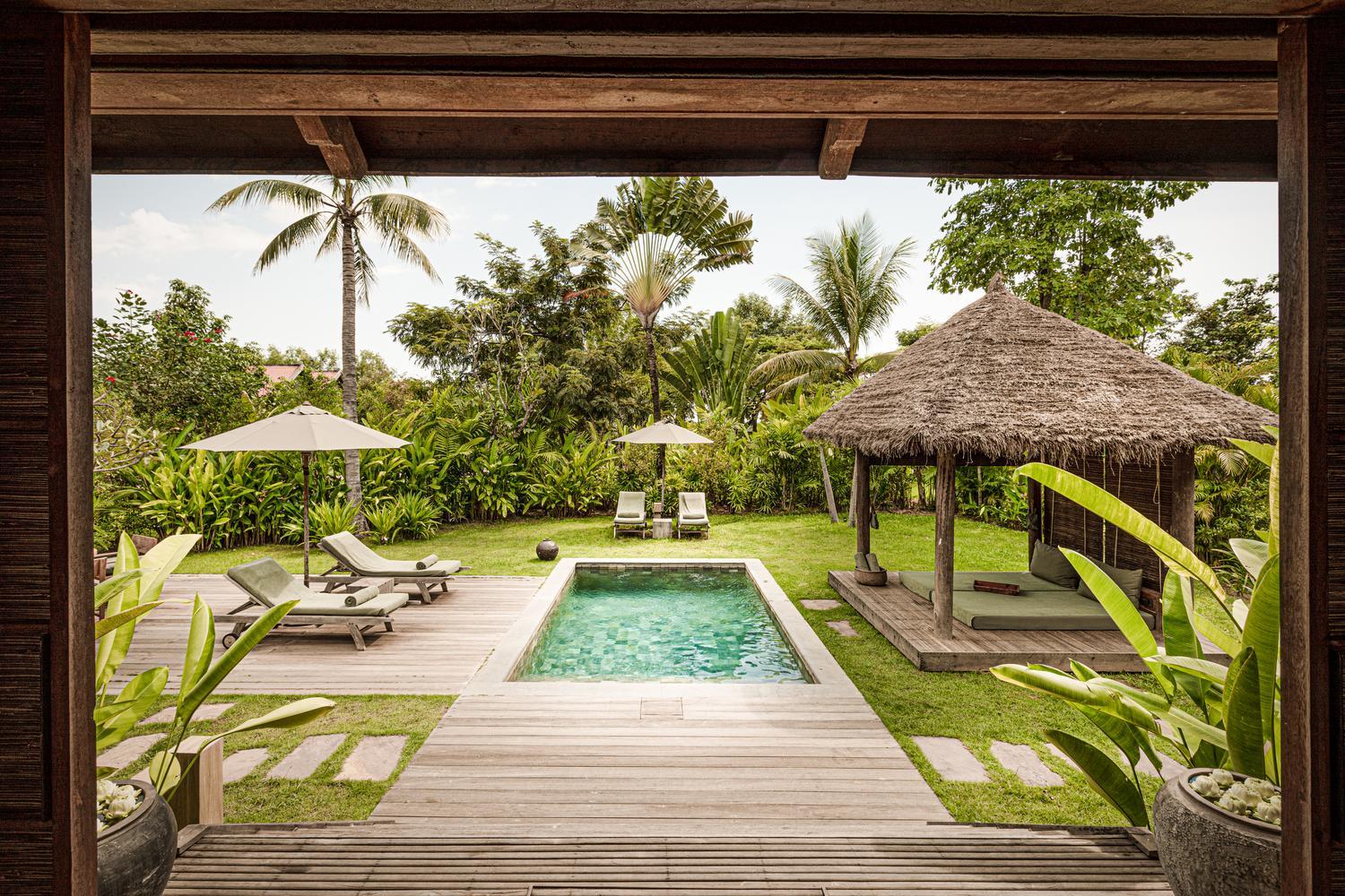 Outdoor pool and garden at Zannier Phum Baitang