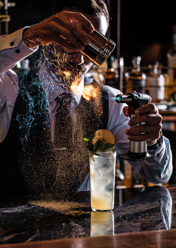 A man making cocktails at Grain Bar at Four Seasons Sydney