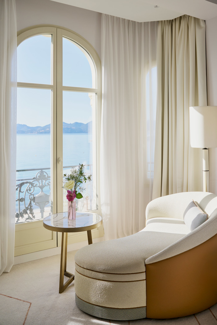The curved daybed in a sea-facing suite at Carlton Cannes.