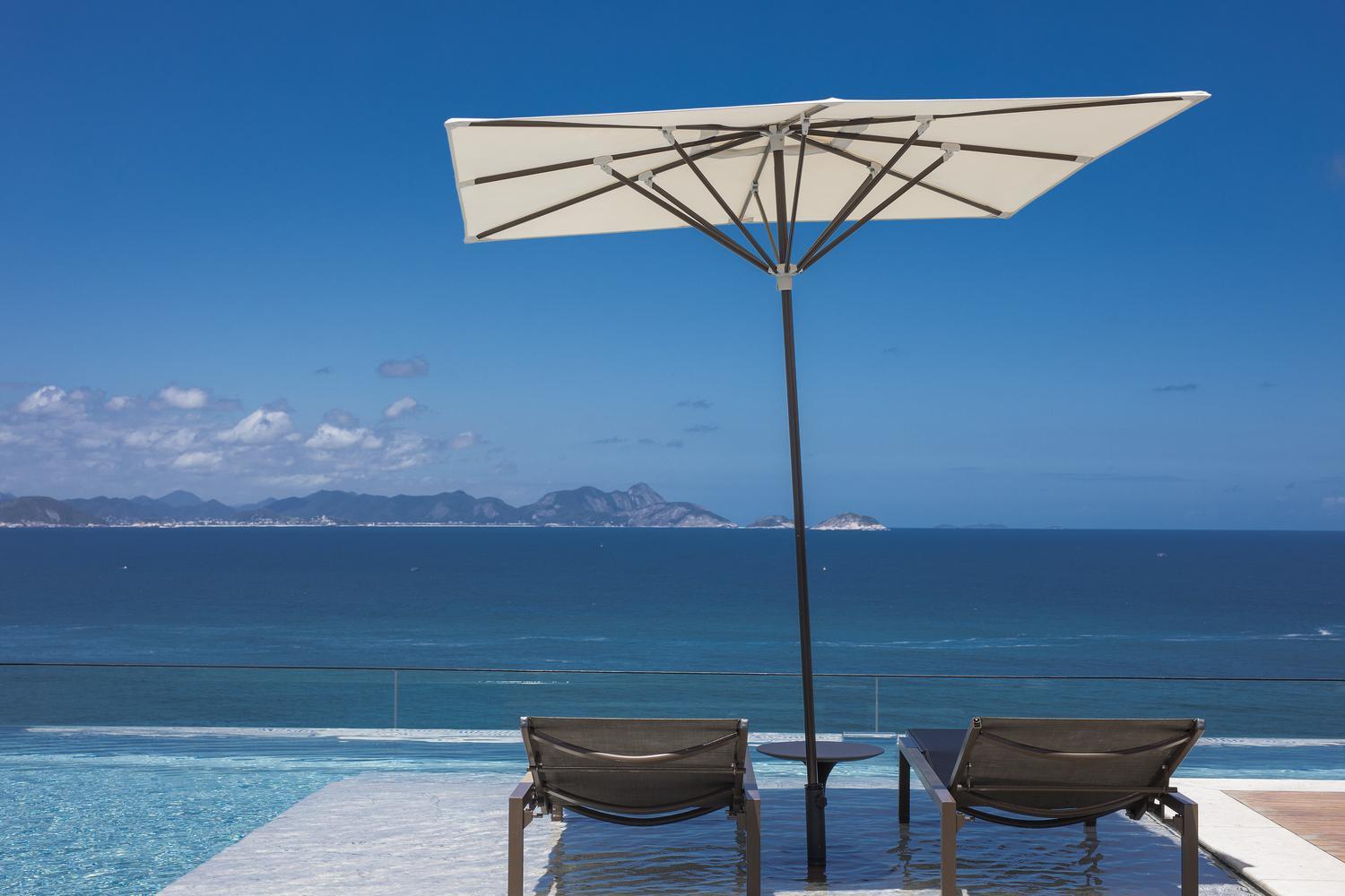 Two sun loungers on the rooftop of Emiliano Rio de Janeiro