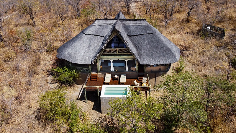 An aerial view of a room at Ikuka Safari Camp, featuring a swimming pool.