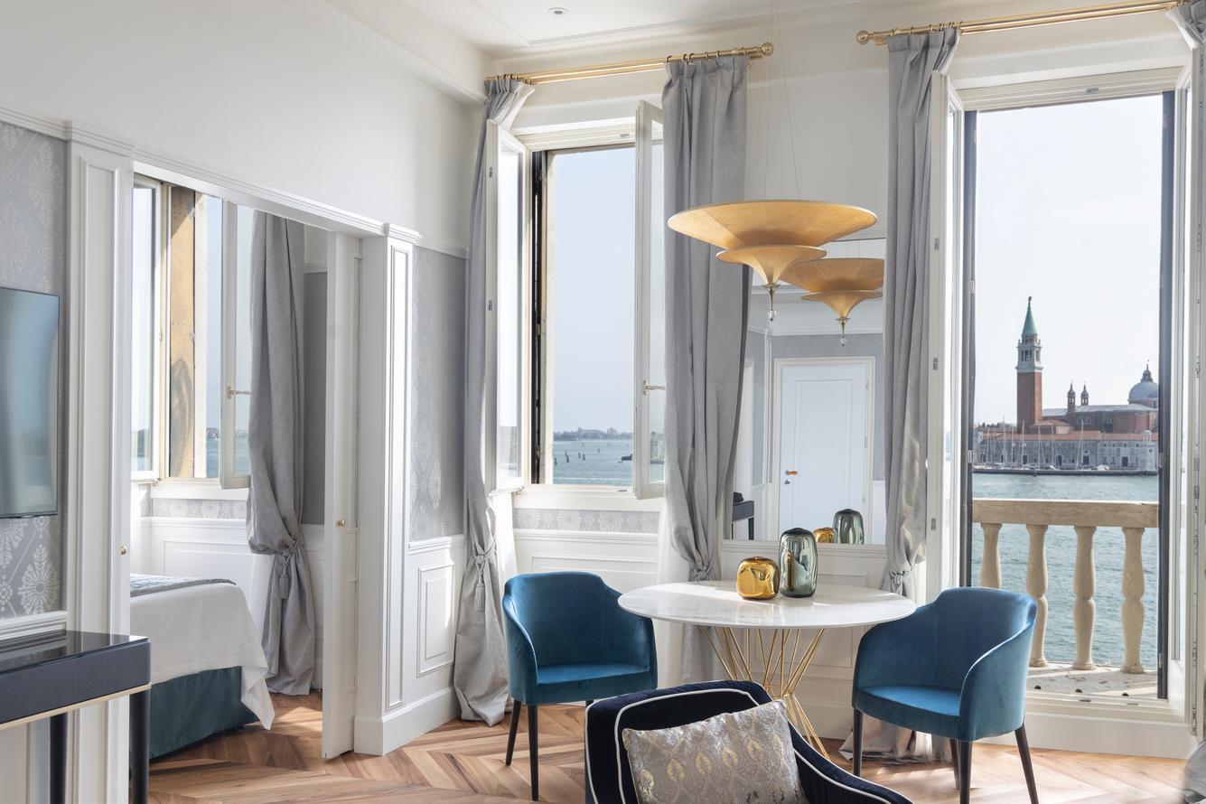 The lagoon-facing lounge area of a suite at Hotel Londra Palace in Venice.