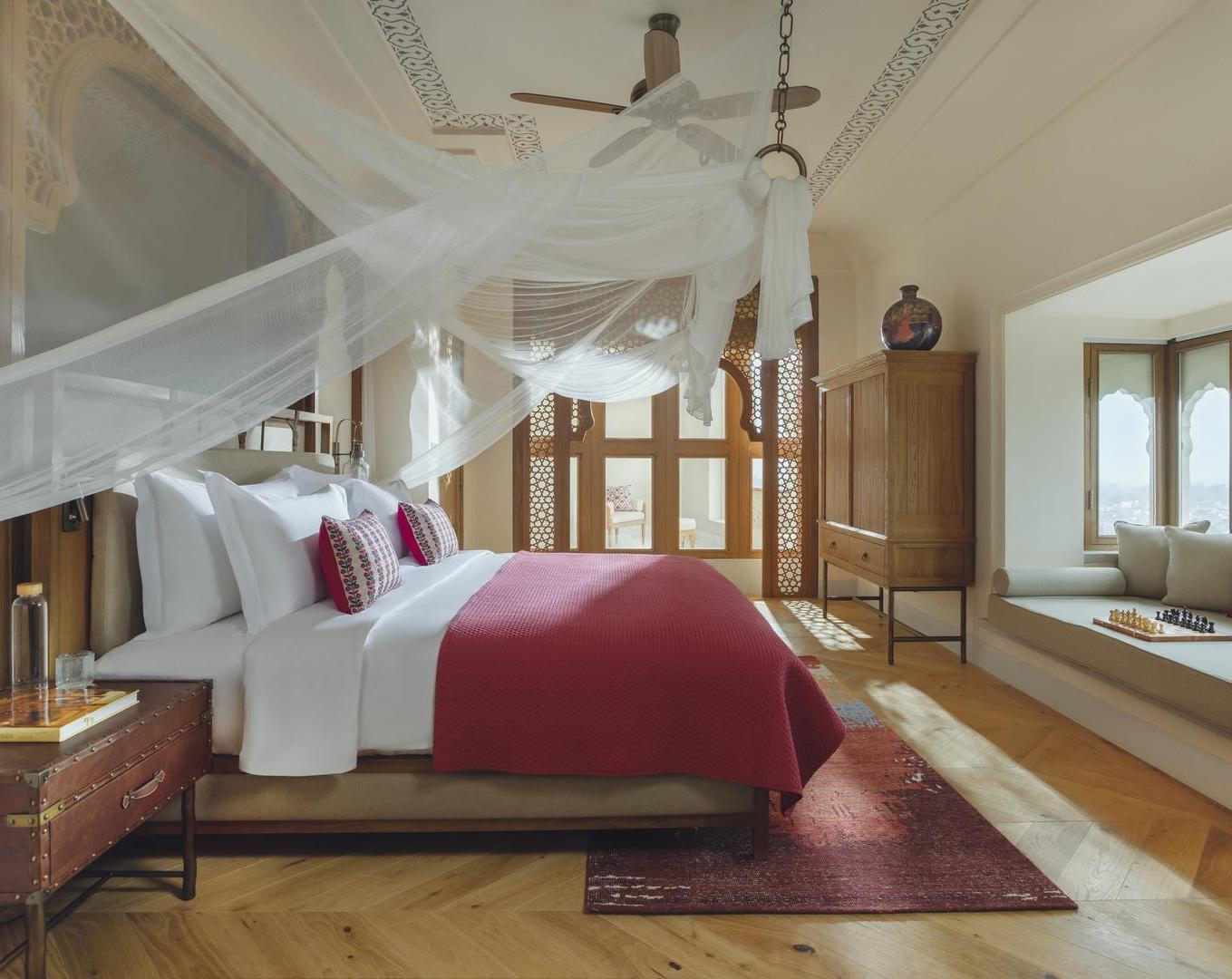 The bedroom of a suite at Six Senses Fort Barwara.