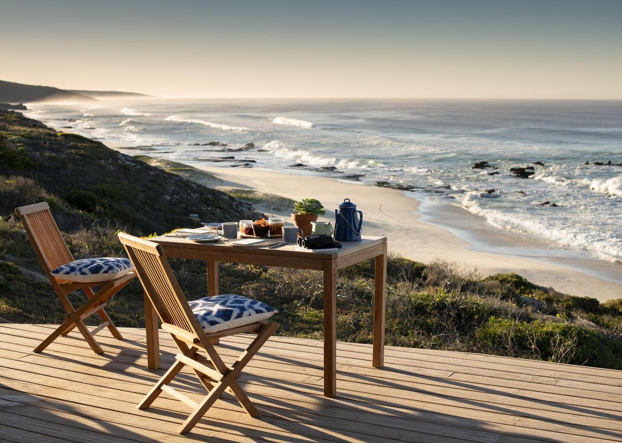 Outdoor dining on the terrace at Lekkerwater Beach Lodge, South Africa
