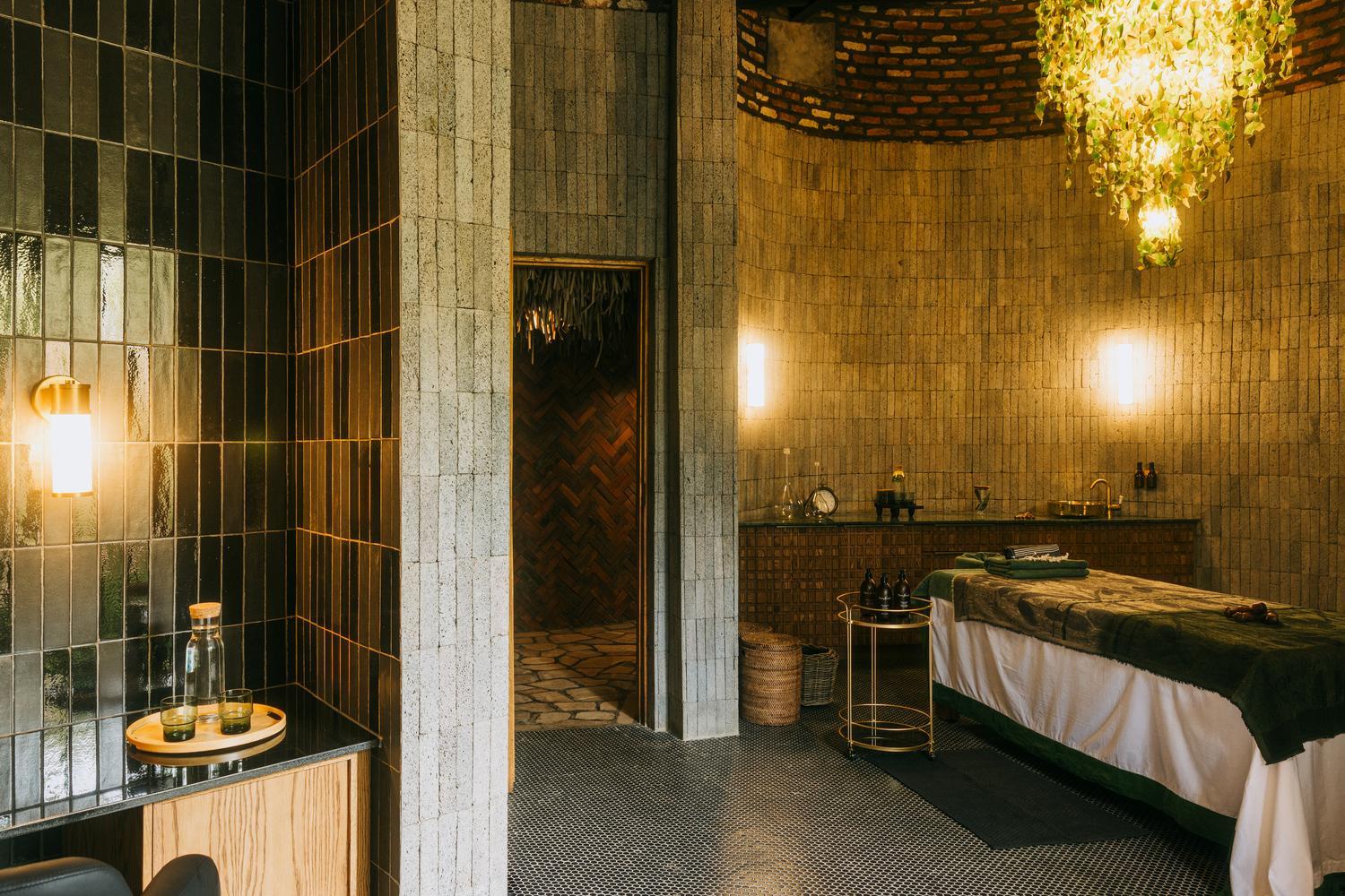 Massage table in private treatment room at The Sanctuary spa at Wilderness Bisate, Rwanda