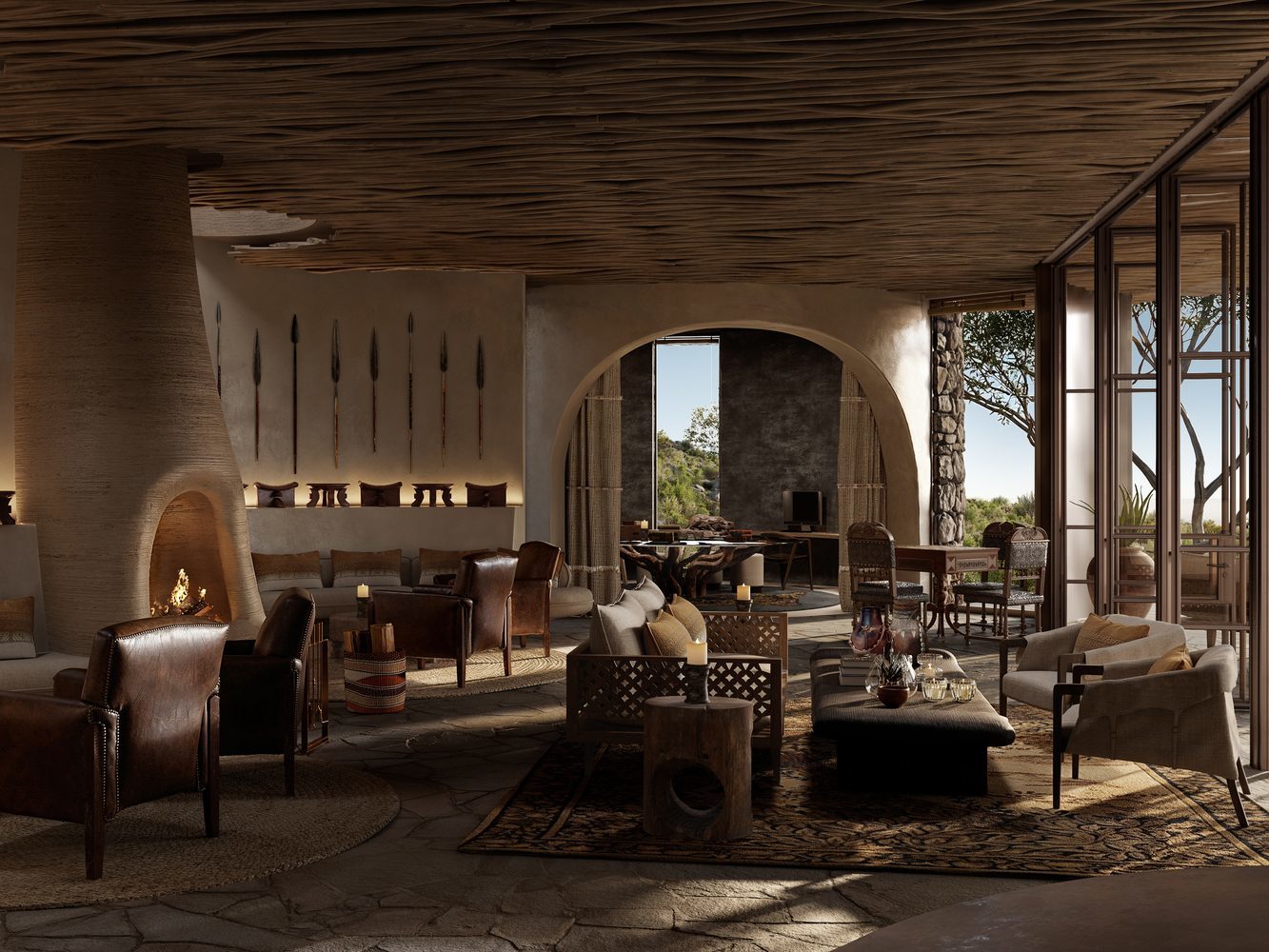 Luxurious interior with fireplace, leather chairs, rustic decor, and large windows.