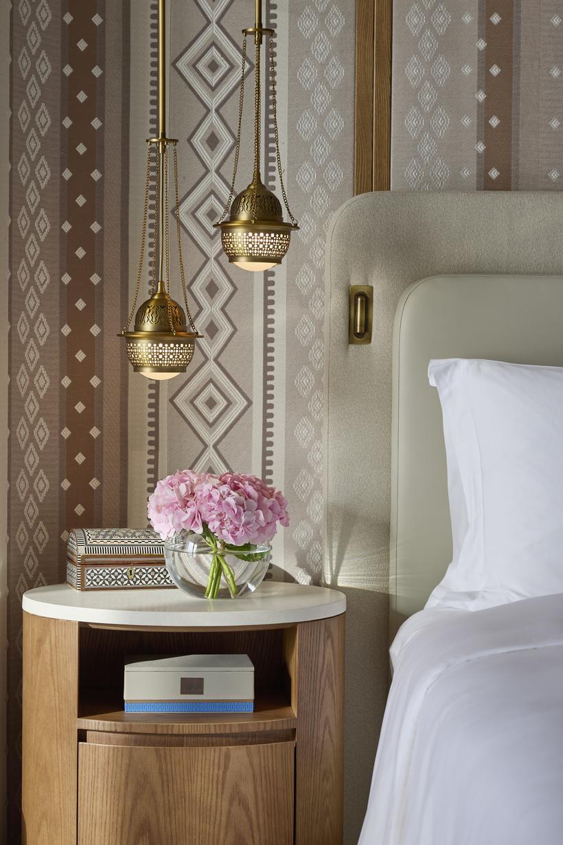 Bedroom details of Mandarin Oriental Muscat. This is a glimpse of bedside lamps inspired by frankincense burners.