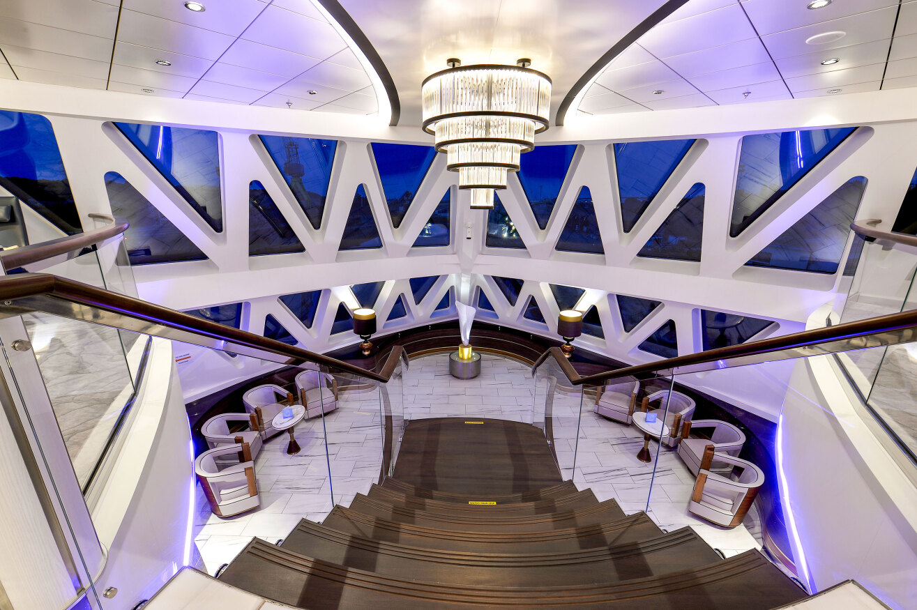 The forward lounge area on the Ocean Explorer with two-storey windows.