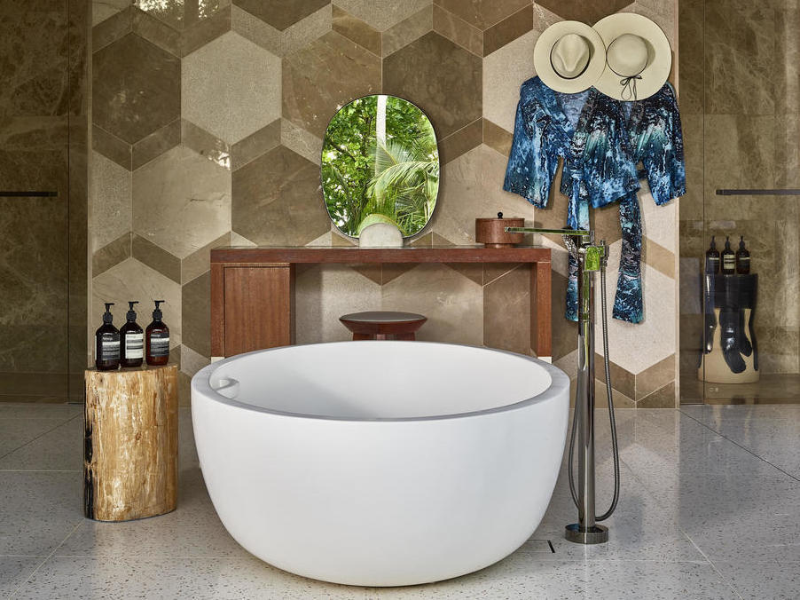 The bathroom in villa at Waldorf Astoria Seychelles Platte Island., featuring a standalone bath.