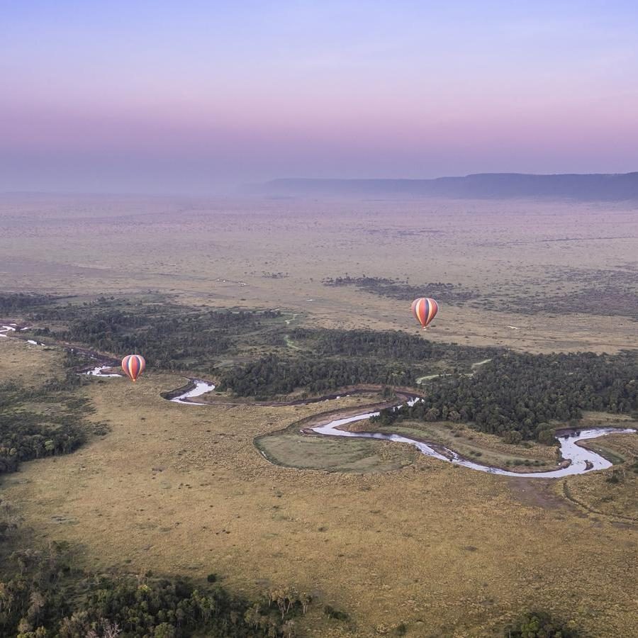 Hot air balloons over the Mara River in Kenya.
