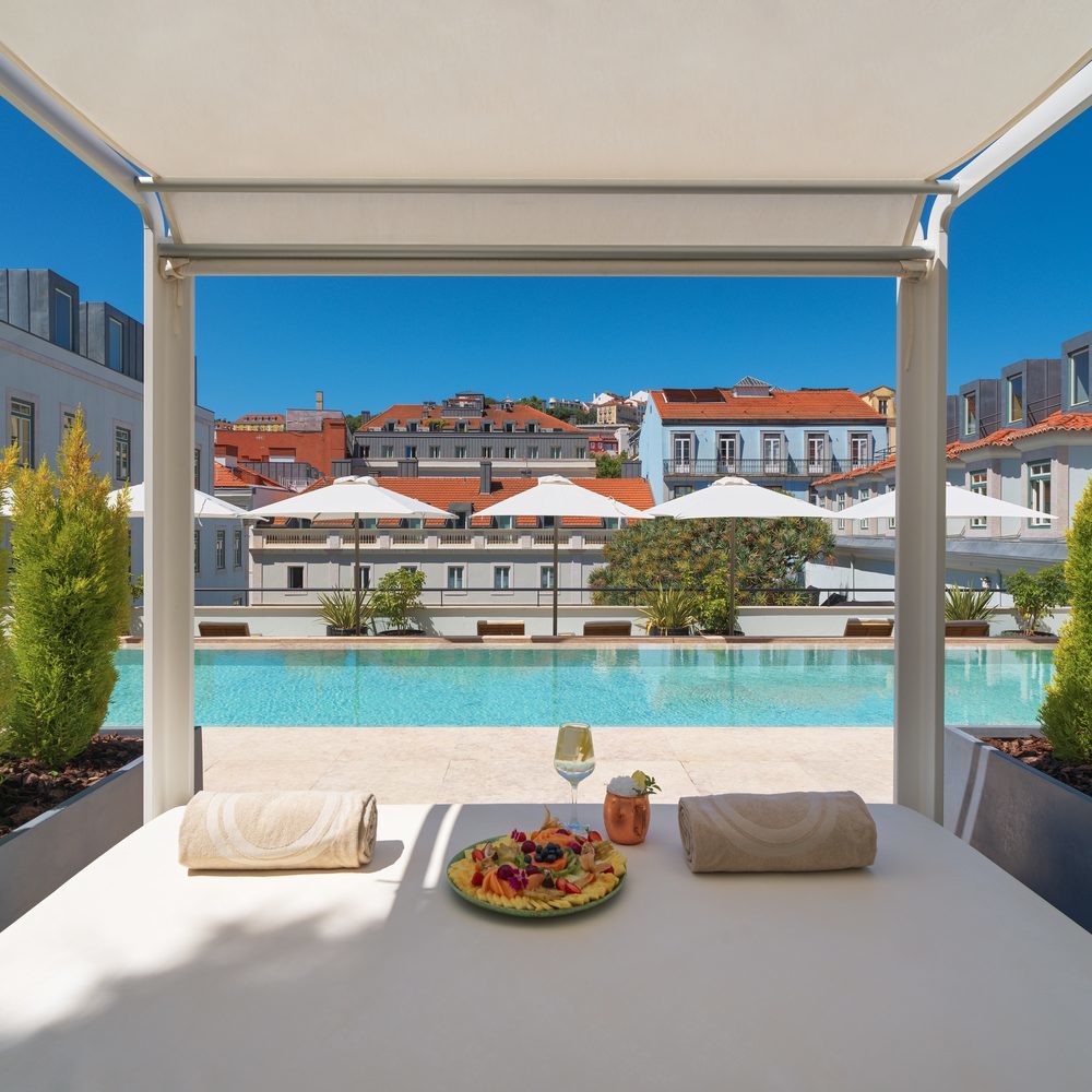 Day beds by the pool at The One Palacio da Anunciada