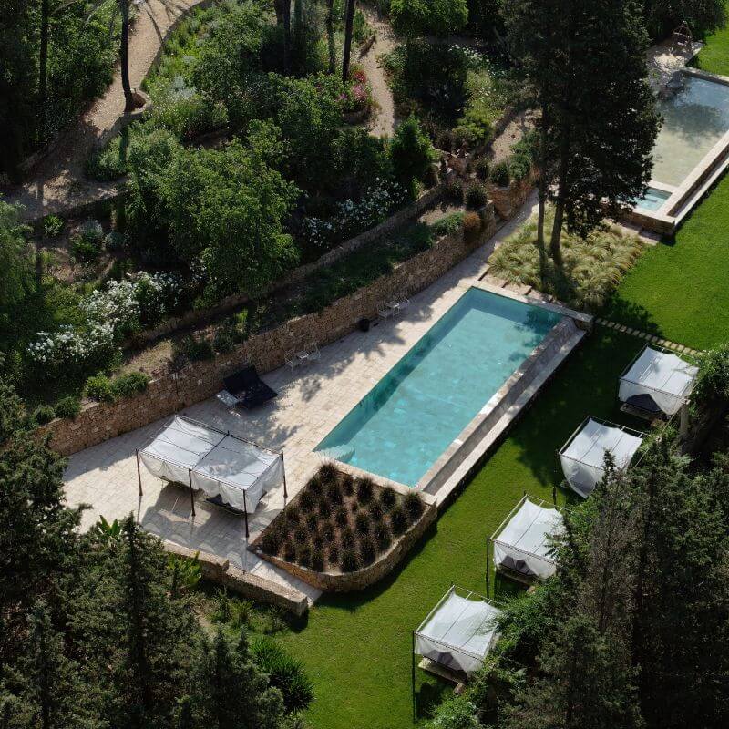 Overhead view of a rectangular swimming pool and gardens