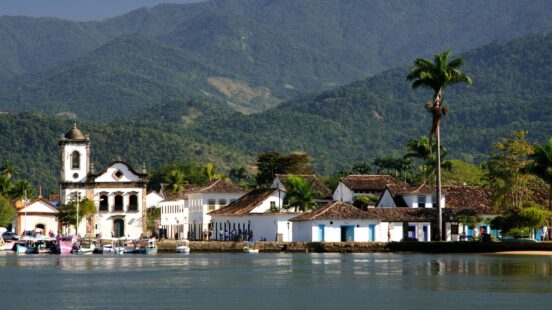 Historic colonial buildings along the waterfront on luxury Latin America honeymoon trips.