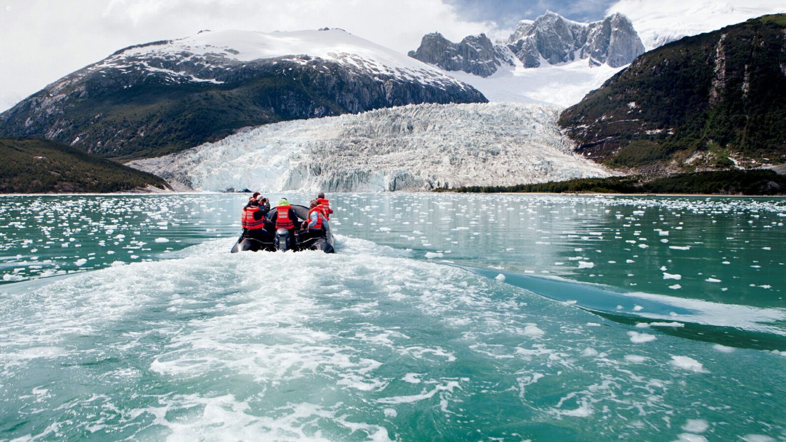 Zodiac boat approaching a glacier in Tierra del Fuego