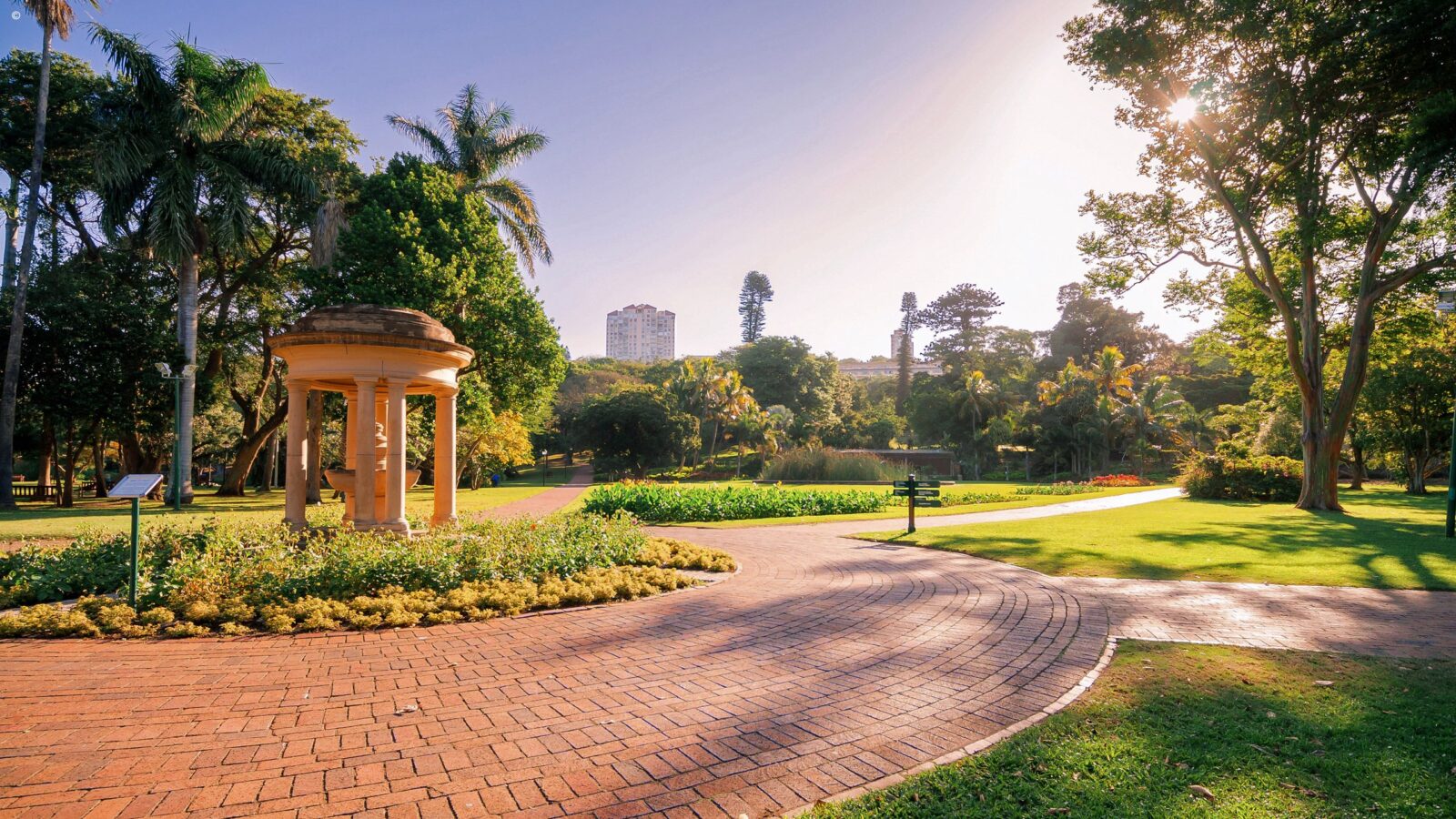A stone rotunda in a lush green park setting for luxury Durban safaris.