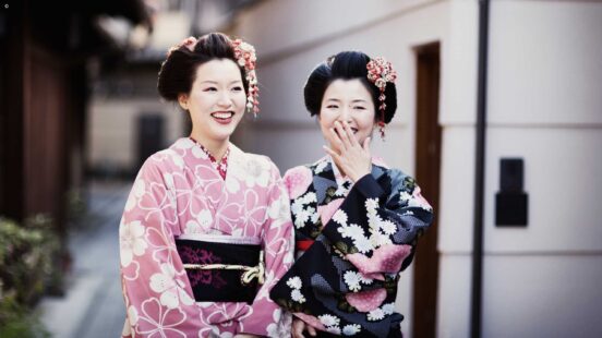 Geishas enjoy an inside joke
