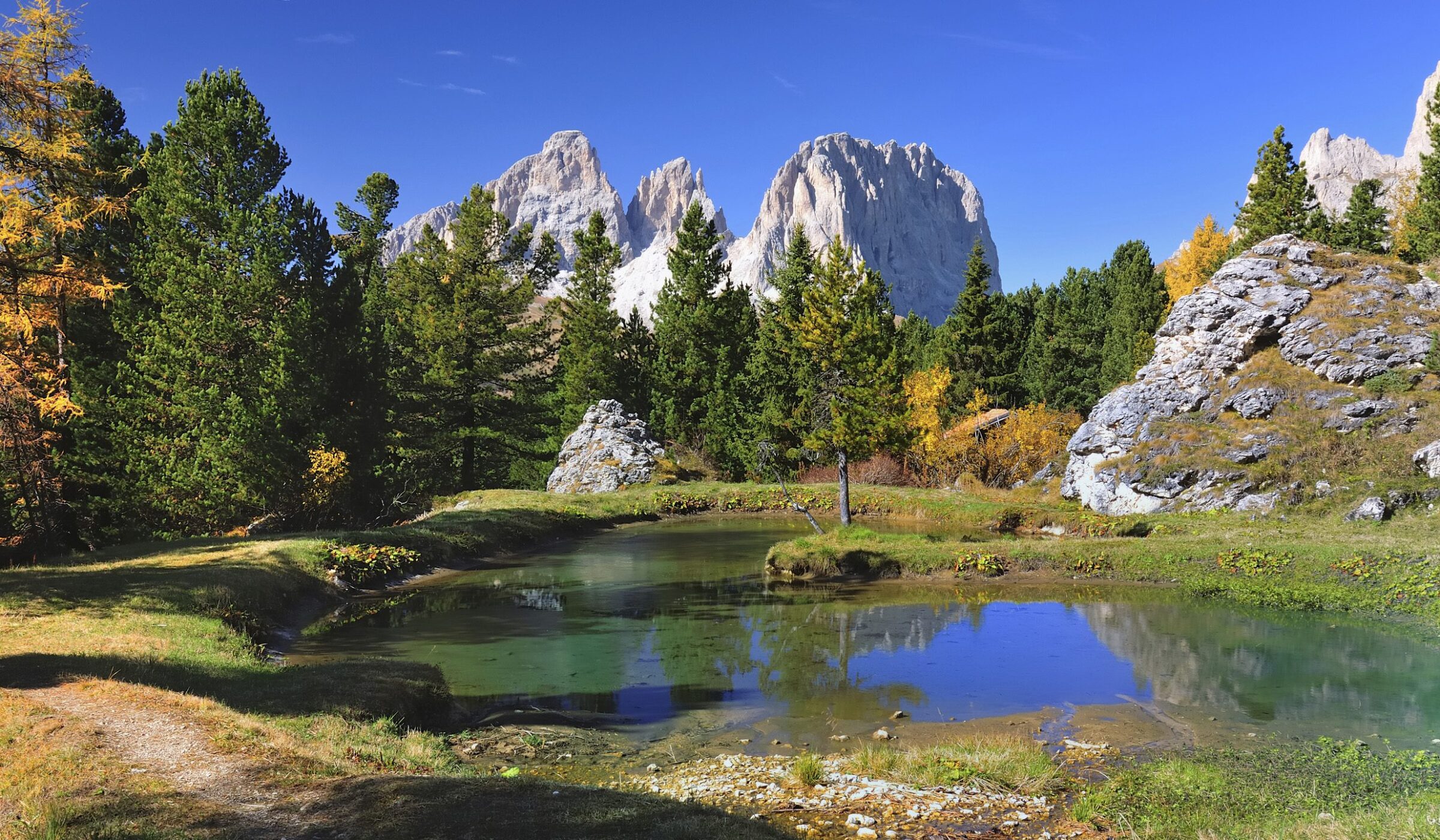 Crystal clear lake nestled in the Dolomites, Italy