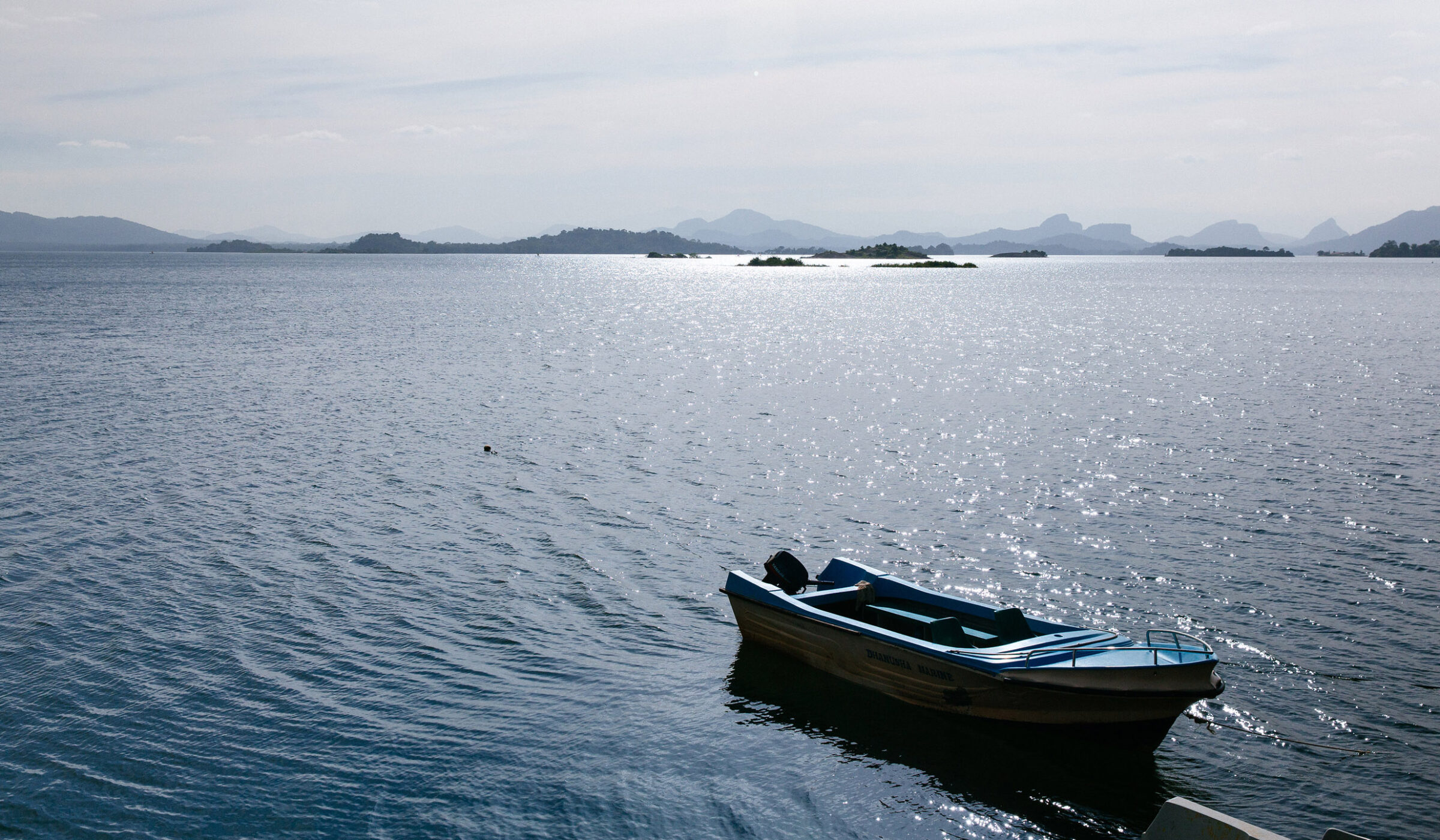 A small motorboat moored in the lake at Gal Oya National Park