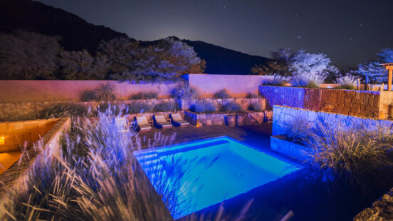 Outdoor swimming pool at night at Hotel Alto Atacama Desert Lodge and Spa, San Pedro de Atacama, Atacama Desert, Chile