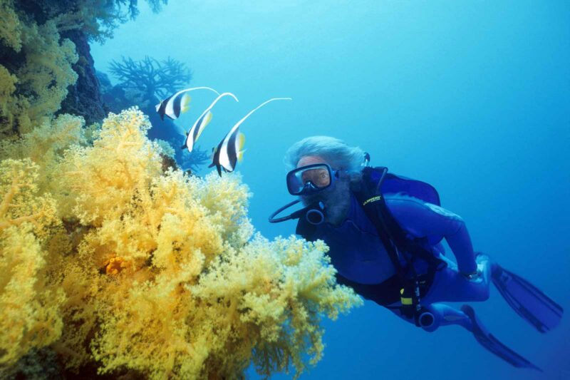 Senior lady scuba diving Fiji