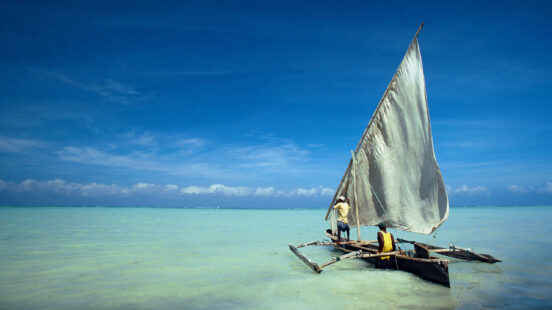 Dhow in the crystal turquoise waters of Zanzibar, Tanzania
