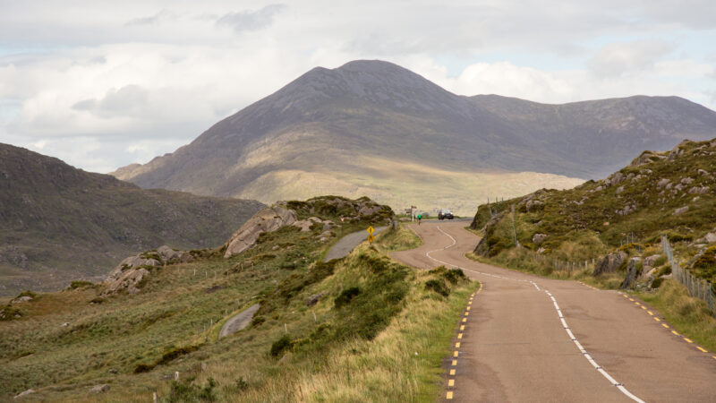 The R658 road winds across moorland at Moll’s Gap mountain pass in the Mangerton Mountains of Ireland’s County Kerry.