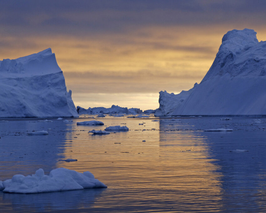 Iceberg sightseeing beneath the midnight sun