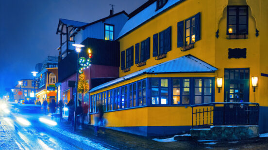 Laugavegur street during a snowstorm in the late evening, Reykjavik, Iceland. Toned image