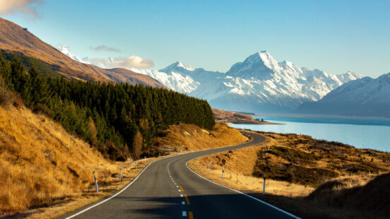 Road to the snow capped Mountains at the top of the lake