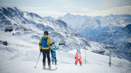 Landscape of the snow-covered mountains and skiers in Cervinia