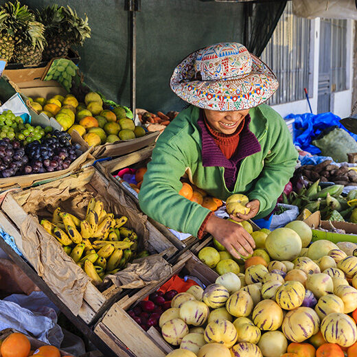 Luxury Peru Tours - Peruvian woman selling fruits, Chivay