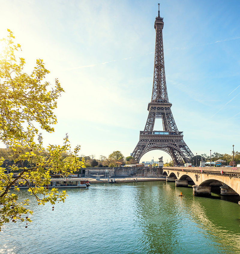 The Eiffel Tower and Seine River in Paris viewed during luxury France vacations.