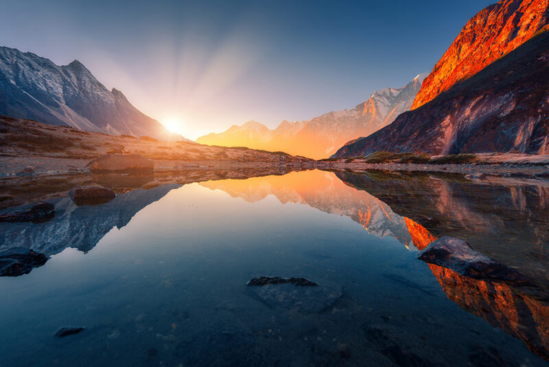 Mountains with illuminated peaks, stones in mountain lake at sunset mountain, stone, sky, reflection, rock, sunrise, sunset, lake, hill, himalayas, peak, water, nepal, nature, outdoor, sunlight, cliff, tourism, scene, coast, vibrant, river, travel, yellow, sunny, horizon, pond, light, evening, dusk, top, sun, twilight, sunshine, morning, dawn, forest, ridge, high, blue, colorful, scenic, beautiful, background, environment, tranquil, landscape, sun rays, panoramic, sunrays Beautiful landscape with high mountains with illuminated peaks, stones in mountain lake, reflection, blue sky and yellow sunlight in sunrise. Nepal. Amazing scene with Himalayan mountains. Himalayas Mountains with illuminated peaks, stones in mountain lake at sun mountain, stone, sky, reflection, rock, sunrise, sunset, lake, hill, himalayas, peak, water, nepal, nature, outdoor, sunlight, cliff, tourism, scene, coast, vibrant, river, travel, yellow, sunny, horizon, pond, light, evening, dusk, top, sun, twilight, sunshine, morning, dawn, forest, ridge, high, blue, colorful, scenic, beautiful, background, environment, tranquil, landscape, sunrays, panoramic, sun rays, Mountain, Mountain Range, Nature, Outdoors Mountains with illuminated peaks, stones in mountain lake at sunset.mountain, stone, sky, reflection, rock, sunrise, sunset, lake, hill, himalayas, peak, water, nepal, nature, outdoor, sunlight, cliff, tourism, scene, coast, vibrant, river, travel, yellow, sunny, horizon, pond, light, evening, dusk, top, sun, twilight, sunshine, morning, dawn, forest, ridge, high, blue, colorful, scenic, beautiful, background, environment, tranquil, landscape, sun rays, panoramic, sunrays.Beautiful landscape with high mountains with illuminated peaks, stones in mountain lake, reflection, blue sky and yellow sunlight in sunrise. Nepal. Amazing scene with Himalayan mountains. Himalayas Beautiful landscape with high mountains with illuminated peaks, stones in mountain lake, reflection, blue sky and yellow sunl