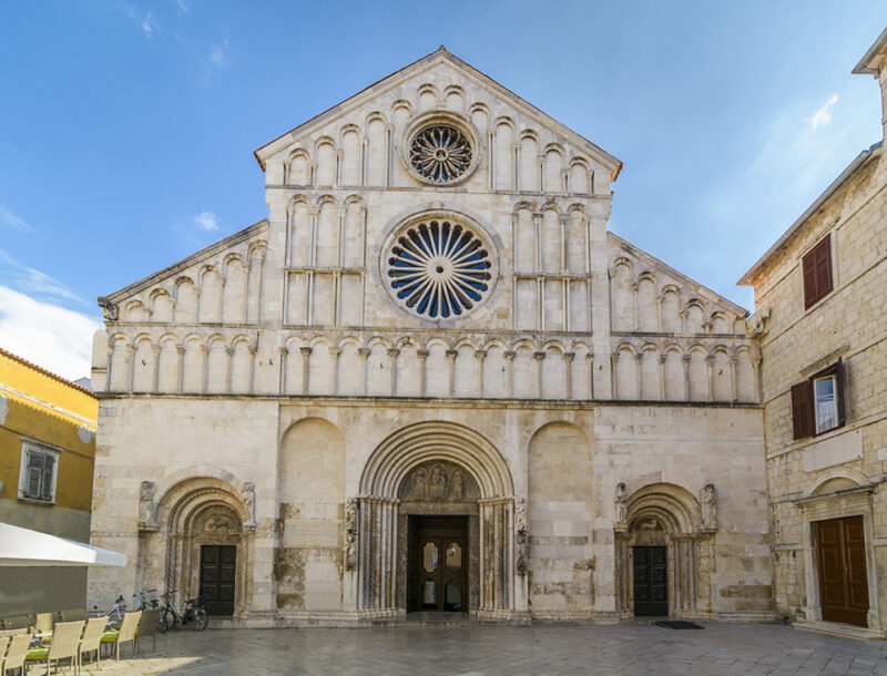 Cathedral St Anastasia Front view in the city of Zadar, Croatia.897524226.catholic, dalmatia, anastasia, landmark, european, historic, destination, mediterranean, adriatic, croatian, st, style, building, stone, coast, famous, site, heritage, saint, sightseeing, view, religious, picturesque, outdoor, ornament, traditional, front.Travel Pack – Croatia, Europe 897524226 catholic, dalmatia, anastasia, landmark, european, historic, destinati, Adventure, Beach, City, Culture, Excursion, Food & Beverage, Nature, Ocean, Outdoor, Architecture, Building, Cathedral, Church, Spire, Steeple, Tower