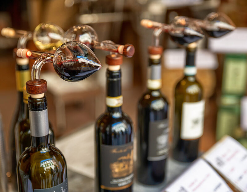 Montepulciano, Tuscany, Italy.August 2021. Close up shot of bott alcohol, background, bar, beverage, bottle, bottles, brunello, business, chianti, choice, city, closeup, collection, display, drink, europe, european, historic, interior, italian, italy, label, light, local, luxury, market, montalcino, montepulciano, red, restaurant, retail, row, sale, selection, shelf, shop, store, taste, tasting, tourism, town, travel, tuscan, tuscany, variety, village, white, wine, winery, val d’orcia, Alcohol, Beer, Beverage, Bottle, Drink, Liquor Montepulciano, Tuscany, Italy.August 2021. Close up shot of bottles with cruet for tasting in a typical local wine shop..alcohol, background, bar, beverage, bottle, bottles, brunello, business, chianti, choice, city, closeup, collection, display, drink, europe, european, historic, interior, italian, italy, label, light, local, luxury, market, montalcino, montepulciano, red, restaurant, retail, row, sale, selection, shelf, shop, store, taste, tasting, tourism, town, travel, tuscan, tuscany, val d’orcia, variety, village, white, wine, winery