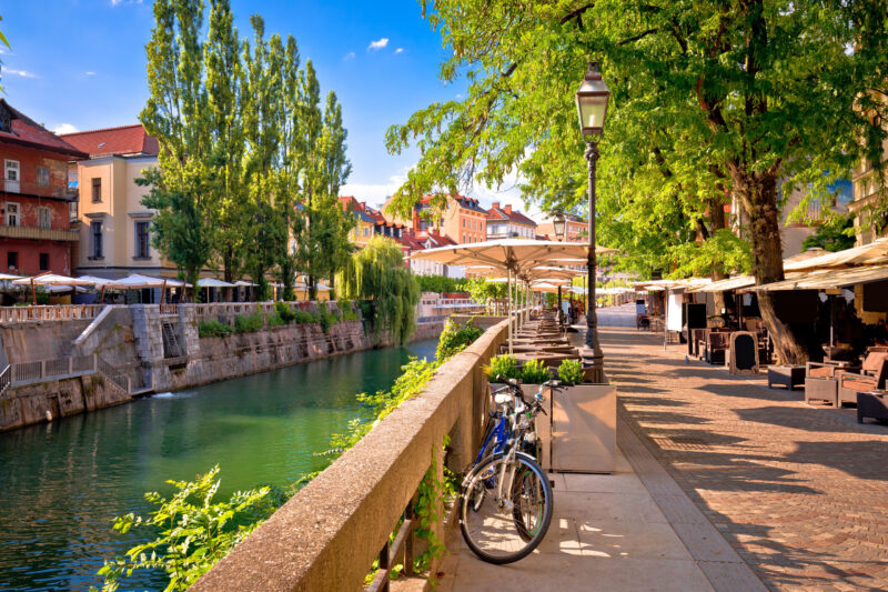 Luxury Grand Tours of Europe - Ljubljana green riverfront promenade walkway summer view