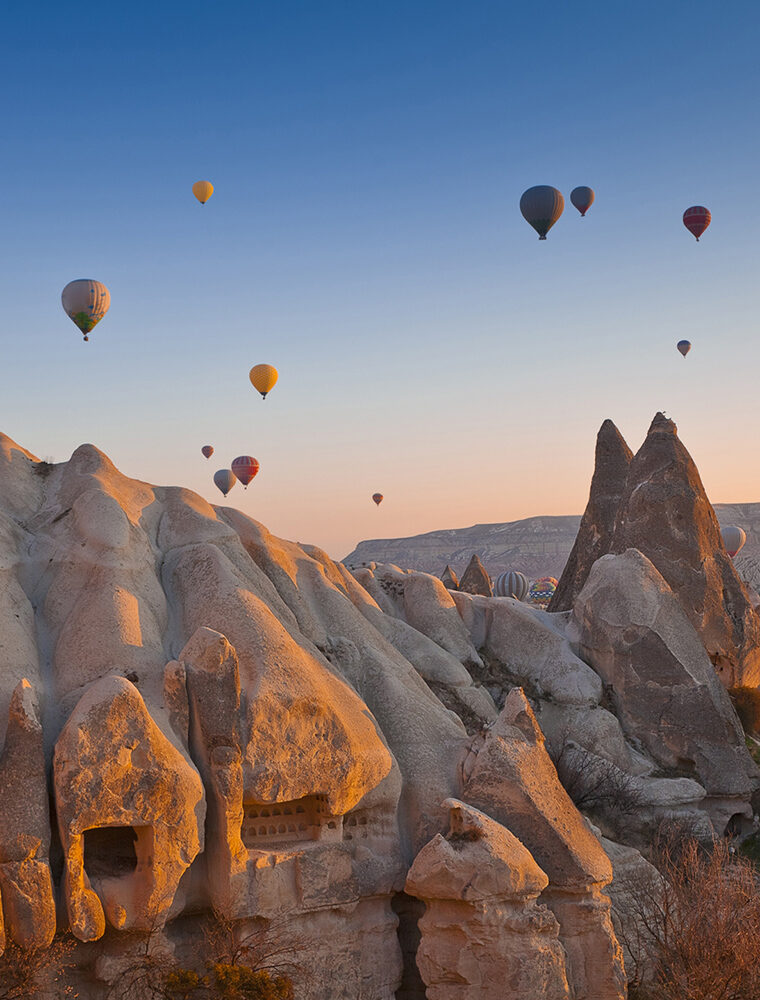 Hot Air Balloons rise up over the Goreme Valley in Cappadocia, Turkey.483421687.Travel, People Traveling, Tourism, Non-Urban Scene, Glowing, Inspiration, Flying, Moving Up, Fun, Heat – Temperature, Motivation, Imagination, Creativity, Journey, Freedom, Adventure, Spirituality, Blue, Pattern, Travel Destinations, Vacations, Transportation, Nature, Rural Scene, Activity, Goreme, Cappadocia, Turkey – Middle East, Sunset, Sunrise – Dawn, Cave, Sky, Balloon, Basket, Hot Air Balloon, Mode of Transport, Air, Country – Geographic Area 483421687 Travel, Tourism, Glowing, Inspiration, Flying, Fun, Motivation, Imagination, Creativity, Journey, Freedom, Adventure, Spirituality, Blue, Pattern, Vacations, Transportation, Nature, Activity, Goreme, Cappadocia, Sunset, Cave, Sky, Balloon, Basket, Air, Country – Geographic Area, Heat – Temperature, Hot Air Balloon, Mode of Transport, Moving Up, Non-Urban Scene, People Traveling, Rural Scene, Sunrise – Dawn, Travel Destinations, Turkey – Middle East, Aircraft, Art, Ball, Balloon, Hot Air Balloon, Outdoors, Painting, Transportation, Vehicle