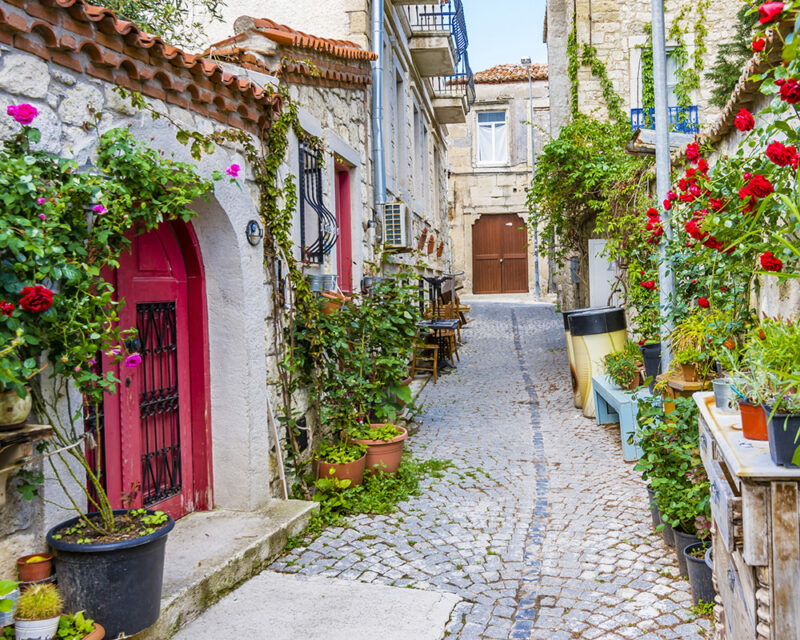 Historical houses of Alacati is populer tourist destination in the Turkey..672033372 672033372 Building, City, Flagstone, Path, Pavement, Plant, Sidewalk, Street, Urban, Walkway
