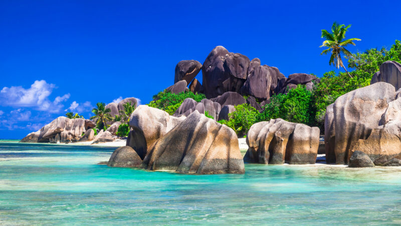 Granite boulders framing the white sands of Anse Source d’Argent on La Digue island.