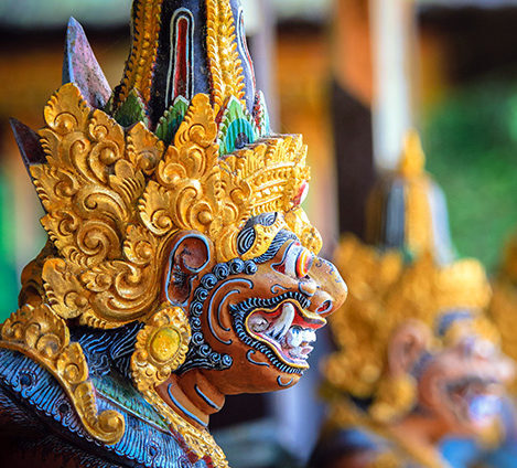 Ornate golden Balinese statue head for luxury culture tours.