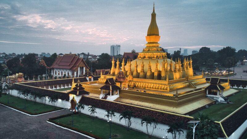 The massive gold-covered Pha That Luang stupa in Vientiane, a landmark for luxury Laos holidays.